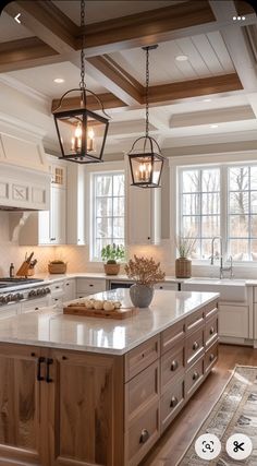 a large kitchen with an island in the middle