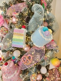 a decorated christmas tree with lots of colorful decorations