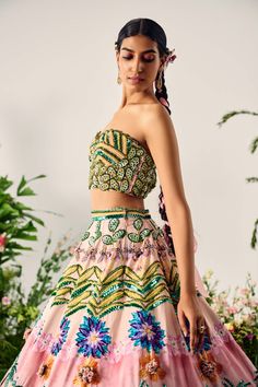 Experience the mesmerizing blend of vibrant hues with this stunning lehenga, crafted in a multi-tropical print and highlighted with intricate beadwork. The corseted blouse features delicate, handcrafted detailing. Multicolor Hand Embellished Bollywood Sets, Hand Embellished Multicolor Bollywood Sets, Festive Hand Embellished Multicolor Sets, Festive Multicolor Hand Embellished Sets, Festive Multicolor Hand-embellished Sets, Multicolor Embellished Sets For Reception, Embellished Multicolor Sets For Reception, Multicolor Hand Embellished Sets For Reception, Multicolor Hand Embellished Lehenga For Party