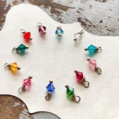 Tiny Swarovski birthstone charms to add on to all your Kyleemae Designs jewelry pieces. Perfect little accents to add onto any of our stamped necklaces or bracelets for that personalized touch. Authentic Swarovski birthstones are 4mm in size and bicone cut. They are handmade on a silver headpin with a 5mm jumpring attached. Simply choose the month you need. Multiple charms? Put each month in your cart individually to choose different colors. These charms feature a jumpring that easily slides ont Nickel-free Silver Birthstone Necklace For Jewelry Making, Silver Jewelry With Faceted Beads For Crafting, May Birthstone Spacer Beads Jewelry Gift, Gift Jewelry With Spacer Beads For May Birthstone, Hypoallergenic Sterling Silver Charms, Birthstone Round Beads For Jewelry Making, Nickel-free Round Beads Charms For Gifts, Nickel-free Round Beads Charm Necklace Gift, Personalized Beads Charms For Gifts