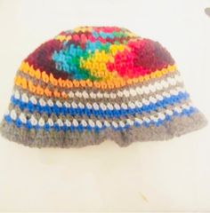 Chakra colors and NY colored beanie for our hippy tribe.  This is a new atyle that fits right above the top of your ear and brow, it fits like a mushroom hat and has a cool strioes pattern and sprial pattern at the top/center of the crochet hat.  This is uniswx and can git children and adults.  Donations can go to your favorite organization.  Please detail in the messages. Happy New Year and thank you for the continued support #teamjennmoves and #teamjennsjewelz. Casual Beanie For Festivals, Casual Rainbow Hat One Size, Casual Rainbow Hat One Size Fits Most, Casual Rainbow Hat, One Size Fits Most, Warm Beanie Hats For Festivals, Casual Multicolor Crochet Cap, Casual Colorful Adjustable Crochet Hat, Casual Adjustable Colorful Crochet Hat, Colorful Adjustable Crochet Hat