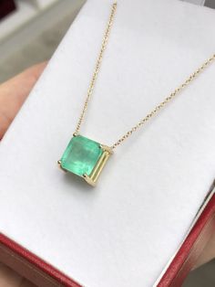 Featured here is a 4.63-carat stunning, Colombian emerald necklace in fine 14K yellow gold. Displayed in the center is a bluish-green emerald with very good clarity, minor flaws are visible to the eye as no emerald is perfect. Accented by a simple four-prong gold mount, allowing for the emerald to be shown in full view. The earth mined, green Colombian emerald has a desirable lush green color with excellent qualities. An 18 inch is attached to the emerald pendant. This necklace is ideal for ever Luxury Emerald Cut Gemstone Necklace, Classic Emerald Cut Gemstone Necklace, Exquisite Emerald Necklace For Formal Occasions - May Birthstone, Exquisite Emerald Necklace For Formal Occasions And May Birthstone, Exquisite Formal Emerald Necklace For May Birthstone, Luxury Yellow Gold Emerald Necklace With Prong Setting, 14k Gold Emerald Cut Fine Jewelry Necklace, Exquisite Emerald Necklace With 17 Jewels For May Birthstone, Exquisite Emerald Necklace For May Birthstone