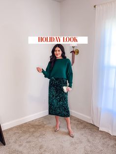 a woman standing in a room with the words holiday look over her head