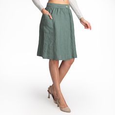 We use GOTS, OCS, GRS, European Flax and Oeko Tex certified linen fabrics. All of our products are handmade from 100% LINEN.  Product Description  - A-line skirt - Mid Waist - Side one pocket - Button closure - Knee length - Relaxed fit - Casual - It is cut and sewn specifically for you by us. - The color seen in the photo is Olive - Model is 5′8″ (178cm) tall, chest size 92cm/36.2″, waist size 75cm/29.5″, hip size 104cm/40.9″ - Wears M 🧼 Washing - Drying Process 🧼 The product has been washed and softened. It will not shrink when you wash it according to the rules. You can machine wash in cold water at 30o on a delicate program. You will get the best results if you hang it to dry. Dry it in the dryer at low temperature and on a short program. However, if you prefer to iron it, iron it on Fitted Cargo Skirt With Button Closure, Green Workwear Skirt With Pockets, Relaxed Mini Skirt With Pockets, Knee-length Solid Mini Skirt With Pockets, Spring Knee-length Mini Skirt With Pockets, Casual Full Skirt With Button Closure, Casual Full Skirt Bottoms With Button Closure, Knee-length Mini Skirt With Pockets, Solid Knee-length Mini Skirt With Pockets