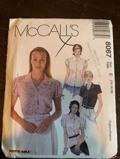 a woman's shirt and skirt pattern on a table top with the words, mccall's x