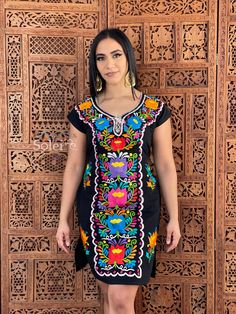 -This Beautiful Mexican Colorful Floral Dress is the perfect dress for a fun night out or a special event. -It is full of colorful embroidered flowers and has some crocheted details. -This dress has ties on the back in order to adjust the fit. Please note: The accesories shown with this dress may purchased as well and Can be found in this links Earrings:https://www.etsy.com/es/listing/855938626/aretes-mexicanos-de-filigrana-aretes?ref=shop_home_active_16&pro=1&frs=1 Shoes:https://www.ets Embroidered Multicolor Mini Dress, Multicolor Embroidered Short Sleeve Dress For Party, Short Sleeve Embroidered Dress With Multicolor Embroidery For Party, Party Dress With Multicolor Embroidery And Short Sleeves, Short Sleeve Embroidered Dress For Party, Embroidered Multicolor V-neck Dress, Fitted Black Dress For Fiesta, Traditional Multicolor Fiesta Dress, Traditional Multicolor Dress For Fiesta