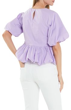 Delightful puff sleeves frame this charming peplum top crafted from crisp poplin. Jewel neck Short sleeves Cotton lining 100% cotton Hand wash, dry flat Imported Feminine Puff Sleeve Top With Ruffle Hem, Spring Cotton Puff Sleeve Top With Short Sleeves, Spring Cotton Top With Gathered Sleeves, Spring Cotton Tops With Gathered Sleeves, Spring Chic Puff Sleeve Top With Ruffle Hem, Fitted Cotton Blouse With Ruffle Hem, Feminine Cotton Puff Sleeve Top, Spring Puff Sleeve Top With Ruffle Hem, Spring Cotton Puff Sleeve Top For Workwear