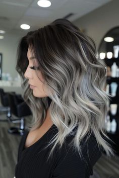 A low maintenance hair color with dark roots is perfect for those who want to keep it simple yet elegant. Ask your stylist to incorporate ash blonde in dark hair in the ombre technique to get the same look as our model here. Tap for 40+ more low upkeep hair color ideas and follow us for more! Dark Hair With Ash Blonde Balayage, Dark Roots Ash Brown Hair Balayage, Dark Root With Blonde Balayage, Fall Hair Ideas 2024, Bayalage Brunette To Cover Grey, Dark Hair Cool Highlights, Dark To Grey Hair Transition, Blonde In Dark Hair, Dark Roots Ash Blonde Hair