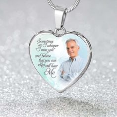 a heart shaped necklace with an image of a man on it and the words, sometimes i