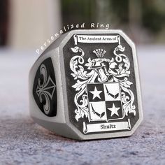 "\"Handmade Family Crest and Coat of Arms Rings - Personalized with Gold and Silver\" Our store specializes in creating unique and stunning \"Family Crest Ring\" and \"Coat of Arms Ring\" options that showcase the rich history and culture of your family. Family crests and coats of arms have been a tradition for centuries, symbolizing the heritage and identity of a family. Our rings are handmade by skilled artisans, featuring your family crest or coat of arms engraved on a beautiful gold or silver band, and embellished with a selection of exquisite gemstones such as emeralds, rubies, sapphires, onyx, aquamarine, and lapis.  Our rings are not only a valuable family heirloom but also make an excellent and meaningful gift for both men and women. We are proud to offer customization options to c Family Crest Ring, Family Crest Rings, Custom Signet Ring, Family Crests, Coats Of Arms, Family Family, Coat Of Arm, Personalized Rings, Family Crest