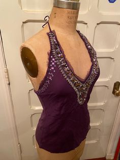 Silk, polyester, and Rayon, dark purple beautiful halter tank top from the 80's. Fairly heavy from the beading, nice weight! Beautiful beaded design around neck line. Perfect for a night out or a sunny day!  Size: M length: 21" waist: 29" bust: (adjustable) roughly 36" 80s Tank Top, Beaded Halter Top, Purple Beaded, Halter Tank Top, Halter Tank, Sherman Oaks, Sunny Day, Dark Purple, Halter Top