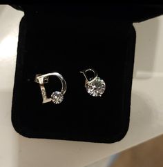 Trendy and Unique pair of D logo Moissanite Diamond Stud earrings come to 1 carat in total weight and in Sterling silver Setting with the larger D logo featuring 3 side smaller stones & a Moissanite diamond Solitaire at the base ,  the smaller D logo stud features a Solitaire also at it's base but has the slightly larger stone at it's base. Passed the diamond tester as Diamond on Diamond selector II  (  These may or may not have a 925 Stamp due to the Unique Setting & custom shape ) . Aaa Quality Silver Diamond Earrings For Anniversary, Aaa Quality Silver Diamond Earrings In Cubic Zirconia, Aaa Quality Silver Diamond Earrings, Sterling Silver Diamond White Earrings, Aaa Quality Diamond White Sterling Silver Earrings, Logo D, D Logo, Diamond Tester, Diamond Stud Earrings