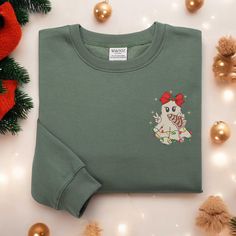 Cute Christmas Ghost Sweatshirt Embroidered Santa Ghost Sweatshirt Christmas Embroidered Sweatshirt Ghost Coquette Sweatshirt Xmas Gift ✨ PRODUCT INFORMATION: 🧵 Material: 65% cotton, 35% polyester 📏 Size and Color Charts: Refer to the photos 🔍 Features: Double-needle stitching on collar, shoulders, armholes, cuffs, and hem ❤️️ CARE INSTRUCTIONS: To keep your sweatshirt looking its best, please follow these care guidelines: 🧼 Machine wash cold, inside-out, on a gentle cycle 🌬️ Tumble dry on Embroidered Cotton Christmas Sweatshirt, Casual Christmas Sweater With Embroidery, Embroidered Christmas Holiday Sweatshirt, Christmas Holiday Embroidered Sweatshirt, Embroidered Long Sleeve Christmas Sweatshirt, Christmas Crew Neck Sweatshirt With Embroidered Graphics, Christmas Embroidered Crew Neck Sweatshirt, Holiday Embroidered Crew Neck Sweatshirt, Embroidered Crew Neck Sweatshirt For Holiday