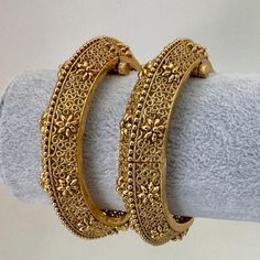 Gold Kada bangles Pair, Indian Amrapali bangles, Antique bangles, Temple Jewelry, South indian bangles, Bridal Bangles, Indian Wedding,  Antique Openable Bangles With Gold Plating sold as a Pair Classic Design Antique Bangle Ships from California, USA Delivery in 3-5 business days in the USA Temple Jewelry Bangle For Wedding And Navratri, Festive Intricate Design Bangle For Diwali, Diwali Bangle With Intricate Design, Festive Diwali Bangle With Intricate Design, Bollywood Bracelets With Motifs For Navratri, Bollywood Style Bracelets With Motifs For Navratri, Bollywood Style Bangle With Diwali Motifs, Bollywood Style Bangle With Motifs For Diwali, Bollywood Motifs Bangle For Diwali