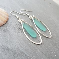 "Aloha! These design shows my love for this beautiful island of Hawaii. This item will be made to order and shipped directly from Hawaii. This is sea glass earrings with silver hooks. This handmade in Hawaii jewelry gift is from cultured sea glass that are specially formed into its shape for jewelry making. Each comes with a gift box with \"handmade by yinahawaii\" stamp and a ribbon wrapped as shown in the 2nd photo, ready to give as gift. I also offer Free gift messaging with the order. Please Wire Wrapped Turquoise, Hawaii Jewelry, Earrings Beach, Sea Glass Bracelet, Island Of Hawaii, Hawaiian Jewelry, March Birthstone Jewelry, Beach Necklaces, Aquamarine Earrings