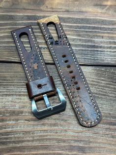 This strap was hand crafted from reclaimed WWII leather boot and hand stitched with off white toger thread. This strap has a keeper crafted from similar leather.  The strap in the picture is the actual strap you will receive. This strap has the beautiful markings and character from the vintage WWII leather boot.  This strap comes with the PVD polished silver buckle as seen in the picture. Let us know if you wish to have a black buckle instead.  All straps will fit ALL Apple Watches with adapters Rugged Leather Watch Strap, Rugged Leather Strap Watch Accessories, Vintage Leather Watch Bands With Waxed Finish, Leather Watch Bands For Outdoor, Adjustable Leather Watch Bands For Outdoor, Vintage Leather Watch Accessories In Distressed Brown, Distressed Brown Leather Strap Watch Accessories, Distressed Brown Leather Watch Strap, Distressed Brown Leather Strap For Watch