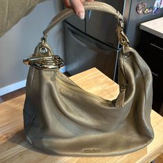 Authentic Gold Jimmy Choo Handbag Made In Italy. In Nearly Perfect Conditions Besides 2 Minor Micro Scratches On Gold Ring. Interior And Exterior Of Bag Is In Perfect Condition With No Stains, Rips Or Tears. Jimmy Choo Bags, Authentic Gold, Jimmy Choo Gold, Jimmy Choo Handbags, How To Make Handbags, Jimmy Choo, Gold Ring, Interior And Exterior, Gold Rings