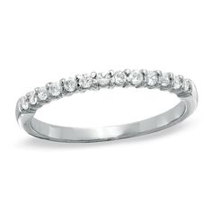 a white gold wedding band with round cut diamonds