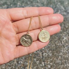 Channel your inner ancient Greek Goddess with these handcrafted medallion pendants. Handcrafted of sterling silver and plated with 18 karat gold, this medallion is then hand etched to feature the warrior Alexander the Great on one side, and a Lion on the other. Alexander the Great was an ancient Greek ruler and one of history's greatest warrior. He established the largest empire the ancient world had ever seen and inspired such loyalty in his men they'd follow him anywhere. In Ancient Greece, Li Symbolic Tarnish Resistant Medallion Necklace, Symbolic Medallion Coin Necklace Tarnish Resistant, Gold Coin Necklace With Large Symbolic Pendant, Mythological Medallion Jewelry Gift, Symbolic Brass Medallion Coin Necklace, Goddess Style Engraved Medallion Jewelry, Symbolic Coin Pendant Charm Necklace, Goddess Style Gold Coin Pendant Jewelry, Gold Goddess Style Jewelry With Coin Pendant