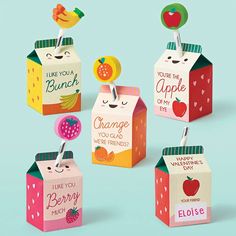 six boxes with different designs on them, one has an apple and the other has a strawberry