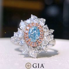 Bienvenue chez Odyssée Joaillerie, nous nous spécialisons dans le diamant coloré et les différentes Pierre précieuse et fine, Nous offrons un grand choix: blanc, ou jaune, ou rose, platine, vos bijoux sont finement fabriqués pour une qualité exceptionnelle!  Symbole d'amour par excellence, le diamant est une belle preuve d'amour. Le joyau de vos rêves est le vôtre! Détails : Marque: Odyssée Joaillerie Métal : or blanc et rose 18k * Pierre centrale : Diamant Bleu très Clair 0,49ct SI2 * Pierres l Gia Certified Oval Diamond Ring In Diamond White, Gia-certified Marquise Moissanite Diamond Ring, Gia Certified Marquise Moissanite Diamond Ring, Gia Certified Oval White Wedding Rings, Dig Jewelry, Gemstone Jewellery Design, Diamond Bracelet Design, Bracelets Design, Bracelet Design