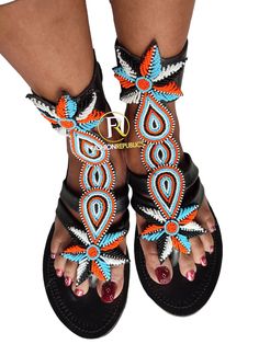 African Sandals. Made using high quality leather And beads. Adjustable Toe Ring Sandals With Open Heel For Beach, Adjustable Toe Ring Sandals With Open Heel For Vacation, Bohemian Open Toe Slingback Sandals, Adjustable T-strap Sandals With Open Heel For Vacation, Handmade T-strap Sandals With Toe Post For Vacation, Beaded Toe Loop Sandals For Vacation, Beaded Sandals With Single Toe Strap For Vacation, Beaded Open Toe Sandals For Vacation, Multicolor Leather Toe Post Sandals