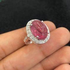 Welcome to  ROYALJEWELLRY  , "WHERE QUALITY MATTERS✌️" Delightful AAAA+ Natural Red Tourmaline Ring//Oval Cabochon Ring// CZ Around//925 Solid Sterling Silver//Engagement Ring//Men-Women Ring// Materials         : 925 sterling silver Center Stone :- Natural Red Tourmaline  Shape : Oval Quality : AAAA+  Accent stone :- CZ Round Shape  Symbolism:- Tourmalines enjoy worldwide popularity. Some people believe tourmalines have healing and stress relieving properties. Tourmalines have also been credite Dazzling Oval Ruby Ring With Prong Setting, Exquisite Oval Ruby Ring With Center Stone, Dazzling Oval Ruby Ring With Halo Setting, Exquisite Oval Ruby Ring In White Gold, Oval Cabochon Ruby Gemstones, Elegant Oval Tourmaline Gemstones, Oval Ruby Gemstones With Center Stone, Oval Tourmaline Wedding Rings, Oval Tourmaline White Gold Rings