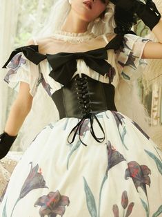 A corset dress with a black lily design that exudes a mysterious atmosphere. An item that expresses mad love. The shoulders and chest are decorated with jet black ribbons. Elegant fluffy and voluminous hem. Please wear it with the included corset. 
 
 
 Size 
 
 
 
 
 S size 
 
 Length: 120cm 
 Shoulder width: 35cm 
 Bust: 88-95cm 
 
 M size 
 
 Length: 122cm 
 Shoulder width: 37.5cm 
 Bust: 96-103cm 
 
 L size 
 
 Length: 124cm 
 Shoulder width: 40cm 
 Bust: 104-111cm 
 
 
 
 
 
 
 
 Material Black Corset With Sweetheart Neckline For Spring, Vintage Black Corset Dress For Cosplay, Spring Black Corset With Fitted Bodice, Black Dress With Fitted Bodice And Overbust, Gothic Black Corset Dress For Spring, Black Gothic Corset Dress For Spring, Black Corset Dress With Boned Bodice And Sweetheart Neckline, Black Spring Gothic Corset, Black Corset Dress With Cancan For Costume Party