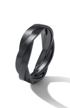 a black ring with three curved bands on it