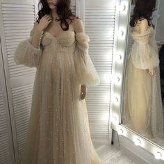 I love this luxury pearl dress with long sleeves and off shoulders😍 Would you like this dress for your event? Evening Cream Tulle Dress, Cream Tulle Dress With Sweetheart Neckline, Cream Tulle Dress With Fitted Bodice, Beige Long Sleeve Dress For Wedding Night, Fitted Cream Tulle Dress, Beige Tulle Dress With Sweetheart Neckline, Beige Floor-length Tulle Dresses, Beige Tulle Floor-length Dresses, Cream Floor-length Dress With Fitted Bodice