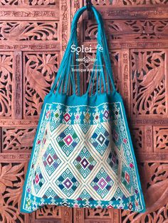 "This gorgeous embroidered Mexican Satchel or Morral is perfect to style with any outfit! The traditional Mexican embroidery is full of culture and colors. This Bag is embroidered on a waist loom. Dimensions: 15.5\" x 15.5\"" Blue Embroidered Bag For Daily Use, Traditional Rectangular Bags With Multicolor Embroidery, Traditional Bag With Multicolor Embroidery, Traditional Multicolor Embroidered Bag For Daily Use, Traditional Multicolor Embroidered Bag, Handmade Blue Shoulder Bag For Festivals, Blue Rectangular Shoulder Bag For Festivals, Blue Rectangular Festival Bag, Rectangular Bag With Multicolor Embroidery For Market