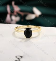 ✦ Handmade ✦ Material: SOLID 14K/18K white/rose/yellow GOLD ✦ Item#:2021622 ✦ Center stone: Black Onyx  ✦ Size: 6*8mm oval shaped Production We are jewelry artisans and manufacturers.  Every ring is made from the very scratch, and made by hand and carefully polished. Custom orders Custom orders are welcome! convo us and we can work out a price and design for your specialty order.  Ring size I can make my designs in any ring size. If the ring size is not in the list, contact us and we'll custom m Black 14k Gold Solitaire Rings, Black Solitaire Ring In 14k Gold, Black Solitaire 14k Gold Rings, Black Rings Stamped 14k As Gift, 14k Gold Black Round Band Jewelry, Black 14k Gold Round Band Jewelry, Black Sapphire Ring In 14k Gold As Gift, Black Oval 14k Gold Rings, Black 14k Gold Band