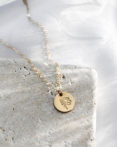 · 1/2" (12.7mm) disc· 14k yellow gold fill, 14k rose gold fill, and sterling silver options· Sturdy, timeless, and built to be worn everydayOur classic 1/2” necklaces are easy to layer, elegant, and ready to be personalized with your most special sentiments, moments, and memories! Created to last a lifetime, these necklaces will remain evergreen even as the years and trends come and go.Personalizing your piece with a message? Reference our fonts and symbols chart for font options and character m Spring Florals, Gold Bar Necklace, Mom Necklace, Disc Necklace, Birthstone Charms, Gold Flowers, Bar Necklace, Spring Floral, Gemstone Necklace