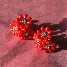 NEW * Vintage 1950's/1960's Midcentury Red Floral Cluster Screw-Back Earrings So fun and sweet! These stunning red floral clusters with sparkling center rhinestone details come to us from the 1950's/60's. Constructed of plastic on metal screw-backs with rhinestones.  These earrings are in excellent vintage condition with no obvious flaws, but with some minor wear. Freshly cleaned and ready-to-wear!  Asking $44CAD, plus shipping if needed. To purchase, ask questions, or see more photos, please DM me 😊 Vintage Red Clip-on Earrings For Anniversary, Vintage Red Clip-on Earrings For Evening, Red Vintage Clip-on Earrings For Anniversary, Vintage Red Earrings For Party, Vintage Red Cluster Jewelry, Vintage Flower Earrings For Party, Red Flower-shaped Earrings For Anniversary, Red Flower-shaped Evening Jewelry, Red Flower Earrings For Anniversary