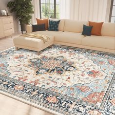 a living room with a large rug on the floor in front of a couch and coffee table