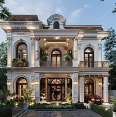 a large white house with lots of windows and balconies on the second floor