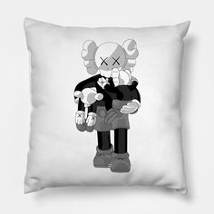 a black and white pillow with an image of a cartoon character holding a teddy bear