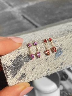 Natural Pink and Orange Colored Sapphires set in 14k Gold - Hand Made in NYC with love • Shop Now! Colored Sapphires, Sapphire Earring, Pear Earrings, Gold Hand, Gold Hands, Sapphire Earrings, Recycled Gold, Pink Sapphire, Pear