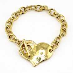 "New version of one of our most popular and unique bracelets - all gold.  - Gold Plated heart with toggle clasp - Gold plated pewter pendant, chain and toggle - Heart measures 1.5\" each way Here is the link to the matching necklace: https://mosaicsunstudio.etsy.com/listing/1630705635 IMPORTANT INFO REGARDING BRACELET SIZING PLEASE READ CAREFULLY BEFORE ORDERING SIZE!! The best way to know what size to order is to measure your wrist. To do the accurately tie a string around your wrist until the Gold Metal Charm Bracelet With Toggle Clasp, Gold Heart Charm Toggle Necklace For Valentine's Day, Gold Toggle Necklace With Heart Charm For Valentine's Day, Gold Toggle Necklace For Valentine's Day, Gold Metal Chain Bracelet For Valentine's Day, Valentine's Day Gold Toggle Necklace, Gold Heart-shaped Charm Bracelet With Adjustable Chain, Gold Heart Toggle Necklace With Toggle Clasp, Gold Heart Toggle Necklace With Adjustable Chain