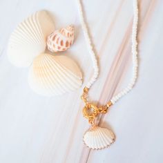 Kama’ole Seashell & Beads Necklace - Made in Hawaii Bohemian Shell With Pearl Charm, Gold Jewelry With Beaded Chain For Vacation, Shell-shaped Pearl Charm For Beach, Beach Shell Necklace With Pearl Charm, White Shell Charm Necklaces For The Beach, Shell Necklace With Pearl Charm For Beach, Shell-shaped Necklace With Pearl Charm For Beach, Shell Shaped Necklace With Pearl Charm For Beach, Ocean-inspired Shell With Pearl Charm For Beach