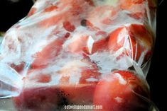 some fruit wrapped in plastic sitting on top of a table