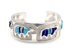 Sterling silver with lapis, turquoise and opal, 1" wide, size 6 3/8 TO SHIP IN 2-3 WEEKS Blue Bangle With Polished Finish, Adjustable Blue Cuff Bracelet Stamped 925, Artisan Blue Bracelets Collectible, Southwestern Silver Bracelet With Multi-stone, Southwestern Silver Multi-stone Bracelets, Southwestern Blue Nickel-free Cuff Bracelet, Southwestern Silver Multi-stone Bracelet, Southwestern Style Nickel Free Blue Cuff Bracelet, Southwestern Style Blue Nickel-free Cuff Bracelet