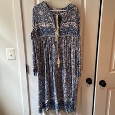 R. Vivimos Tassel Bohemian Midi Dress. Color Light Blue. Size Xl. Fits Like A Large In The Top. Never Worn. Nwt. Flowy Boho Dress With Tassels, Spring Boho Tunic Dress With Tassels, Bohemian Tunic Dress With Tassel Ties, Casual Boho Maxi Dress With Tassels, Blue Vacation Dress With Back Tassel Tie-up, Blue Long Dress With Boho Print, Casual Long Sleeve Boho Dress With Tassels, Blue Long Boho Print Dress, Long Blue Dress With Boho Print