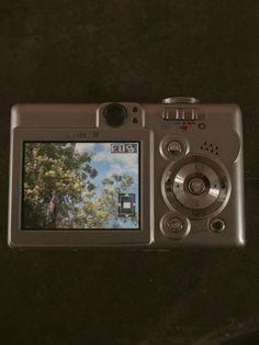 a digital camera sitting on top of a table