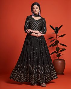 Be the luxurious diva at parties this season in this enticing Black flared anarkali dress from our georgette collection. The all over gleaming sequin & thread embroidered anarkali dress is crafted to beautifully in top quality Georgette fabric to give you a shiny as well as silhouette enhancing fit for your upcoming parties, festivities, wedding functions, & so on. As seen on the model, the mesmerizing outfit is teamed with matching bordered as well as embroidered Georgette Dupatta. Gown For Plus Size Women, Long Anarkali Gown, Engagement Gown, Georgette Anarkali, Long Anarkali, Gown Party Wear, Georgette Dupatta, Plus Size Gowns, Anarkali Gown