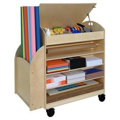 a wooden toy cart with lots of books and supplies on it's wheels,