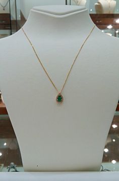 "Natural Emerald necklace, made with 14k yellow gold and diamonds, this beautiful pear shaped pendant is set with round cut halo diamonds. All together creating a lovely piece that suitable for women and teenager girls. A perfect gift for graduation, birthday, holiday or any meaningful occasion. Emerald is the birthstone of May. The pear shape emerald weights 0.45 carat is full of rich color, surrounded by 16 halo diamonds of 0.14 carat VS-G. * Packed in elegant jewelry box, ready to gift * Appr Gift For Graduation, Pear Shaped Pendant, Emerald Style, Packing Jewelry, Daughter Necklace, Emerald Necklace, Green Gems, Emerald Jewelry, Pear Shaped Diamond