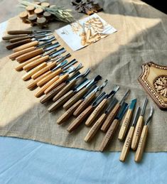 a table topped with lots of different types of woodworking tools on top of a cloth