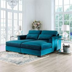 a large blue couch sitting in a living room