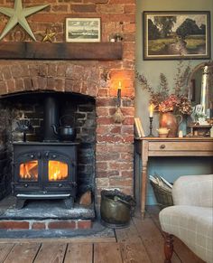 an old brick fireplace in a living room